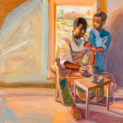 Image of a man showing a child how to use a pottery wheel.